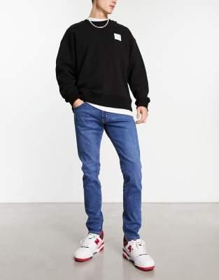 Wrangler Bryson skinny jeans in blue - ASOS Price Checker