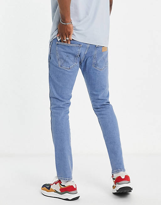 Wrangler Bryson skinny jeans in mid blue | ASOS