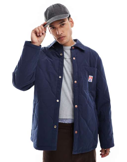 Wrangler – Casey Jones – Workwear – Wendbare Hemdjacke in Marineblau mit Steppmuster und Karos in lockerer Passform