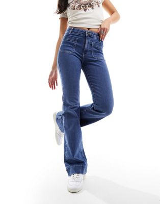 Wrangler super high rise flare with front pockets in mid blue - ASOS Price Checker