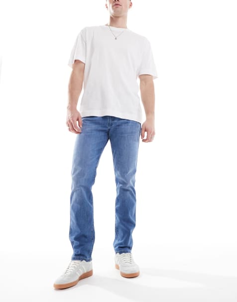 Wrangler Larston slim tapered fit jeans in mid wash blue - view 1