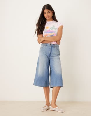 longline jorts in washed light blue