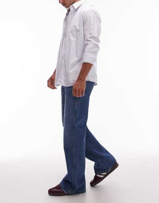Wrangler - Mellemblå og forvaskede jeans i løstsiddende pasform med bootcut-snit, 3 af 5