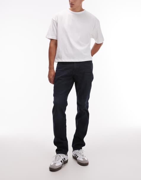 Wrangler – River – Schmal zulaufende Jeans in verwaschenem Dunkelblau mit regulärer Passform - view 1