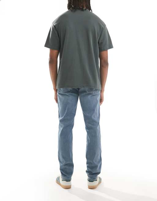 Wrangler – River – Zwężane jasnoniebieskie jeansy o regularnym kroju, 3 z 5