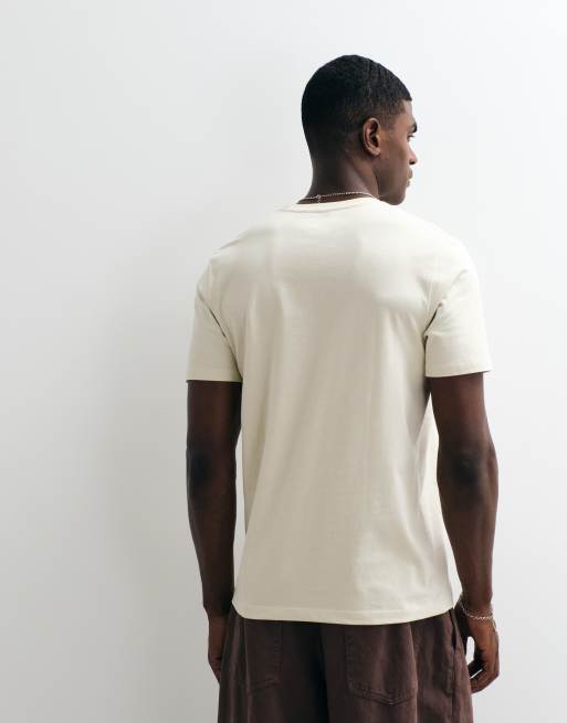 Wrangler – T-Shirt in Cremeweiß mit kleinem Grafikprint, 3 von 5