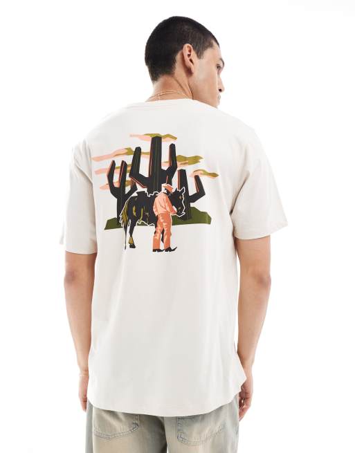 Wrangler – T-shirt o luźnym kroju w kolorze złamanej bieli z kowbojskim nadrukiem na plecach