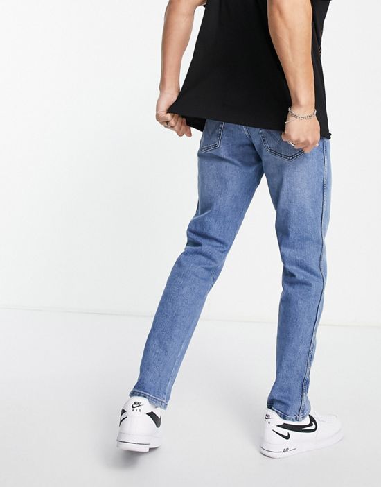 https://images.asos-media.com/products/wrangler-texas-straight-jeans-in-blue/201262241-2?$n_550w$&wid=550&fit=constrain