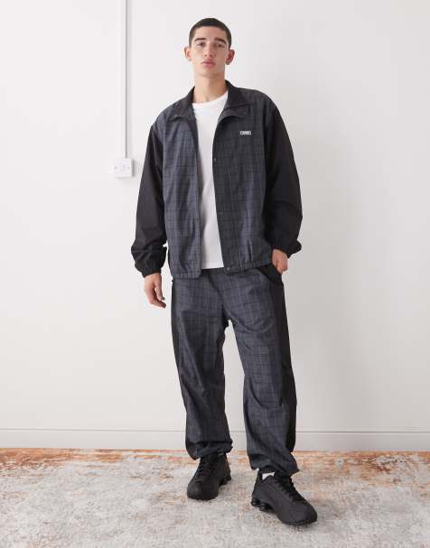 XLARGE logo colour block cuffed tracksuit bottoms in black and grey check