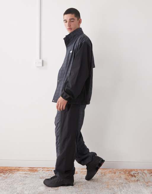 XLARGE logo color block cuffed tracksuit bottoms in black and gray plaid, 3 of 5