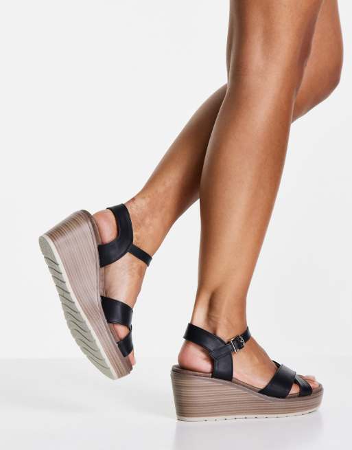 XTI cross strap wedge sandals in black ASOS