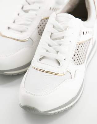 gold coloured trainers