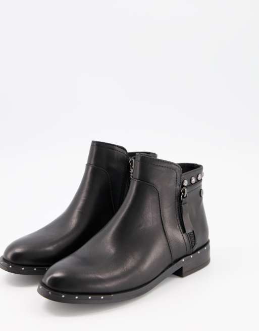 XTI side zip flat ankle boots with studs in black ASOS