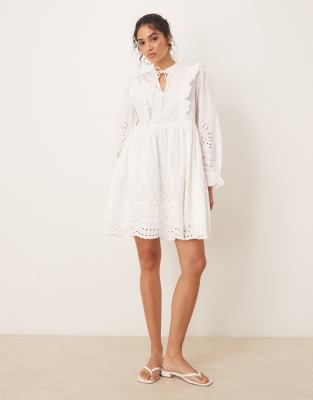 broderie cutwork detail tie neck mini dress in white