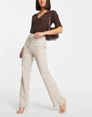 beige high waisted trousers