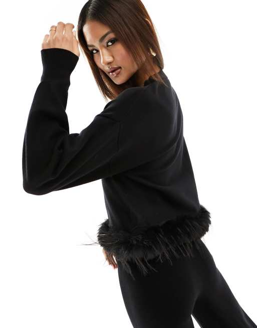 Black jumper with fur sleeves sale