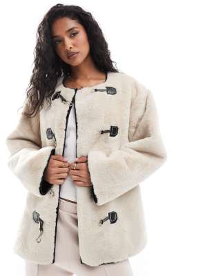 faux fur jacket with buckle fastening in neutral