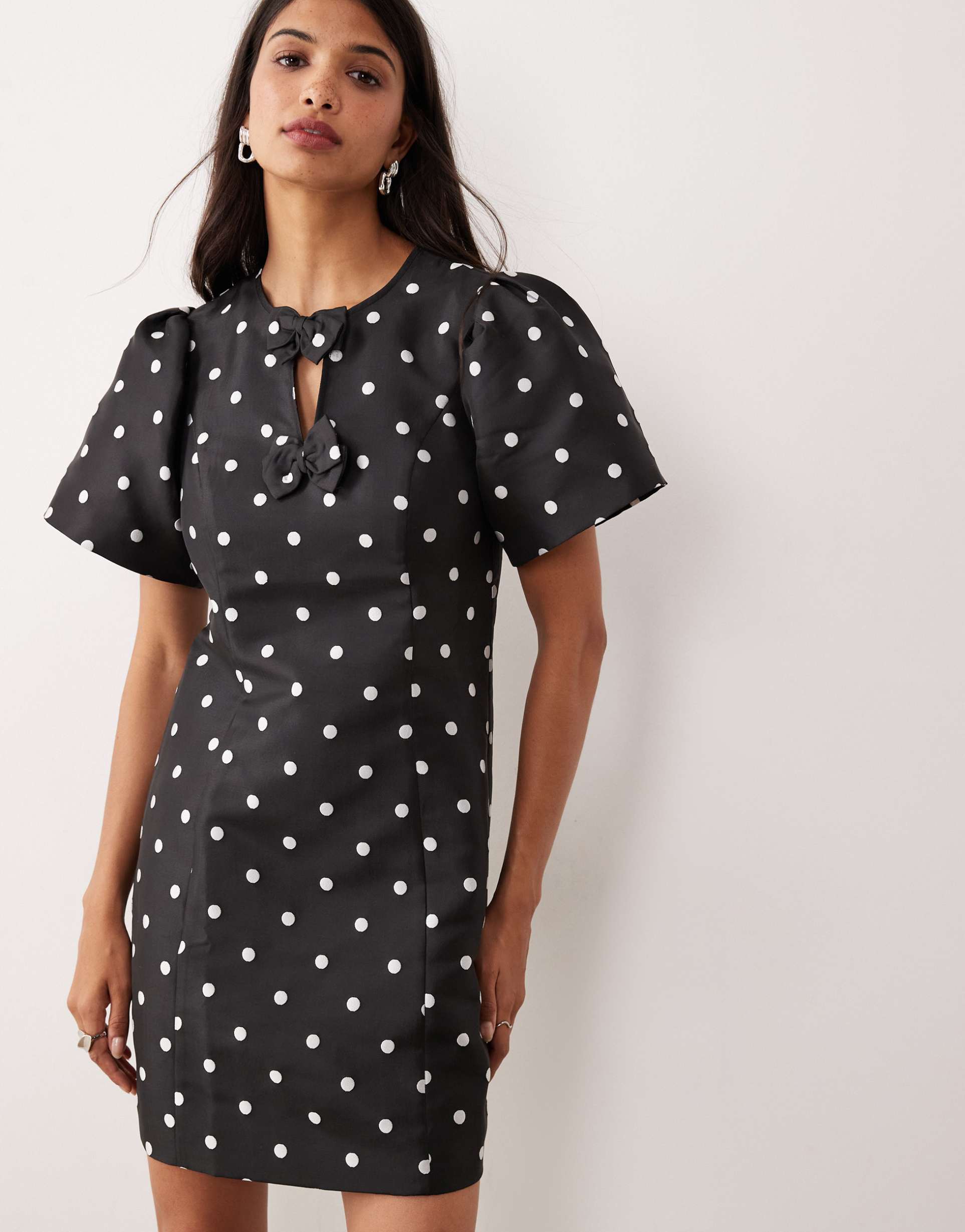 yas puff sleeve structured mini dress in black & white polka dots