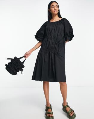 black dress with puffy sleeves