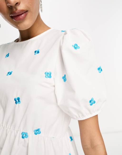 White dress with blue best sale embroidered flowers