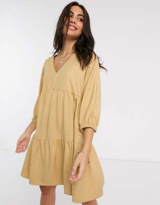 yellow and tan outfit