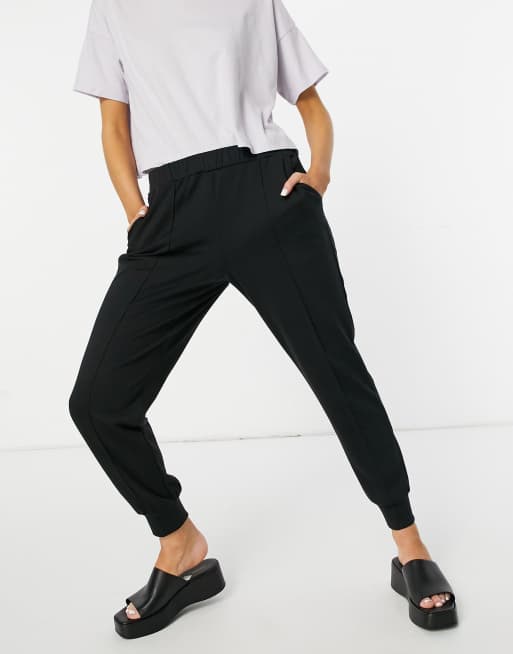 Y.A.S track pants with front seam in black