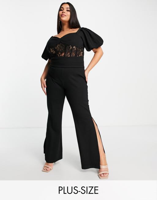 Yaura Plus - Tuta jumpsuit in pizzo nero con dettaglio a corsetto e maniche a sbuffo