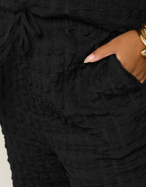 Yours Clothing Bubble textured wide leg trousers in black, 2 of 4