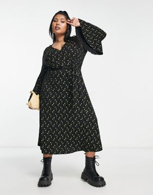 Yours flared sleeve ditsy floral wrap dress in black
