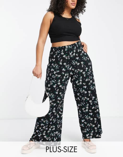 Yours – Hose mit weitem Bein in Schwarz mit Retro-Blumenmuster