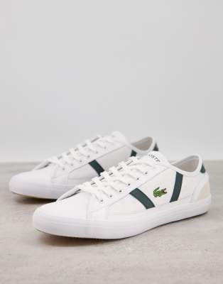 Zapatillas blancas con rayas laterales verdes de Lacoste-Blanco