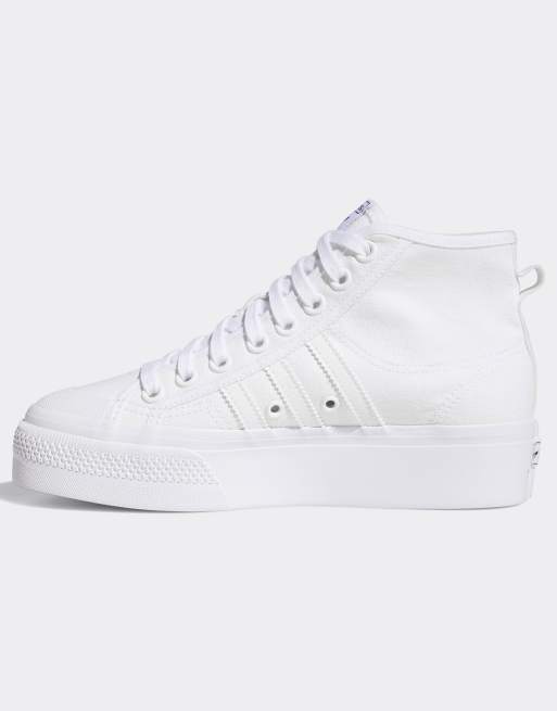 Zapatillas con plataforma en blanco Nizza de adidas Originals