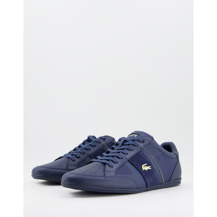 Zapatillas de deporte azul marino/dorado Chaymon de Lacoste ASOS