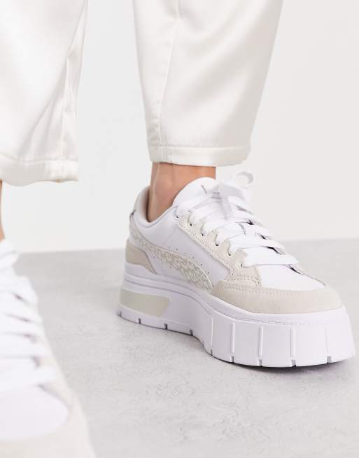 Tenis Puma para mujer con plataforma blancos, negros y leopardo.