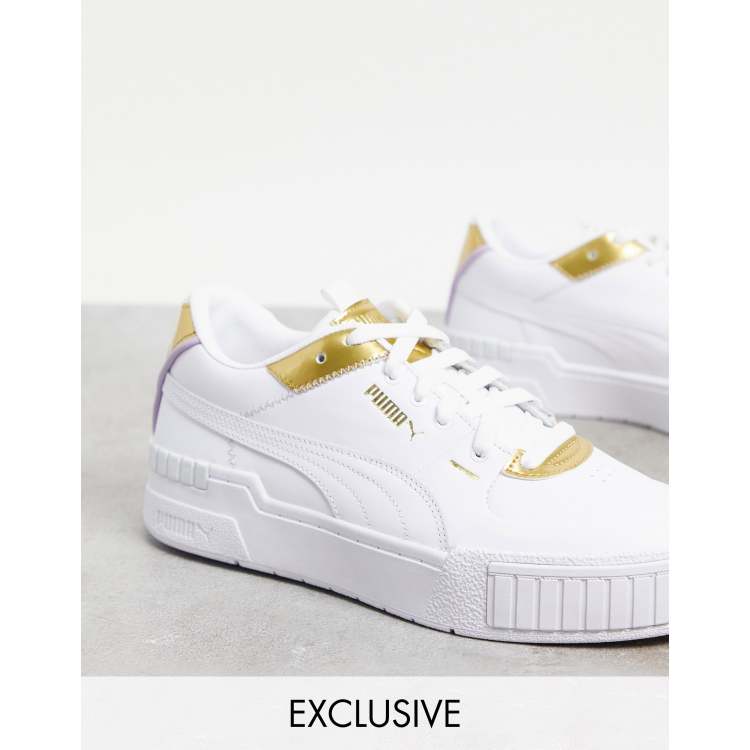 Zapatillas puma blancas store con dorado