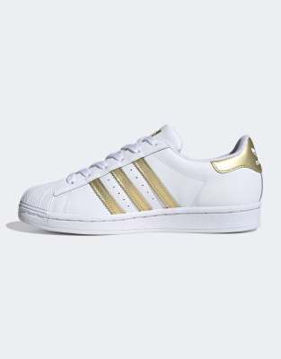 Adidas superstar shop blancas doradas