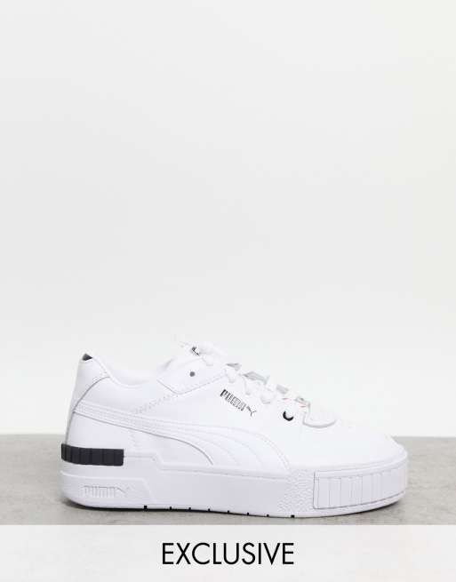 Zapatillas de deporte blancas y negras con logo felino repetido Cali Sport exclusivas en ASOS de Puma