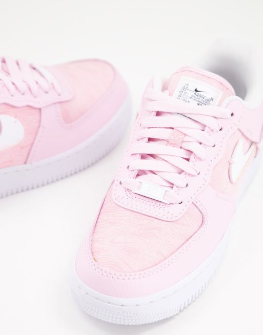 Zapatillas de deporte blancas y rosa beb Air Force 1 07 LXX de Nike