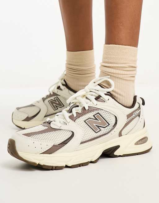 New balance blancas y marrones shop