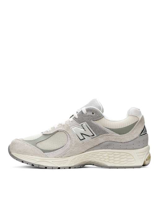 New balance store gris y doradas