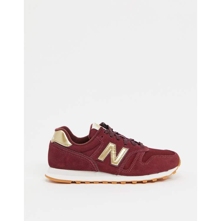 Zapatillas de deporte de color burdeos y dorado 373 de New Balance
