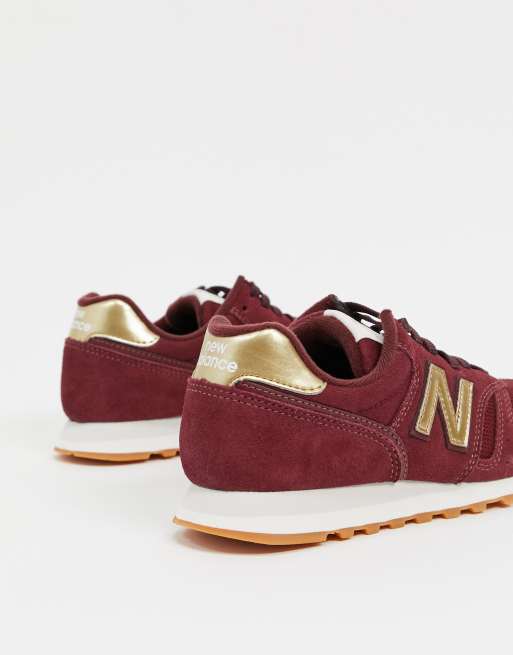 Zapatillas de deporte de color burdeos y dorado 373 de New Balance