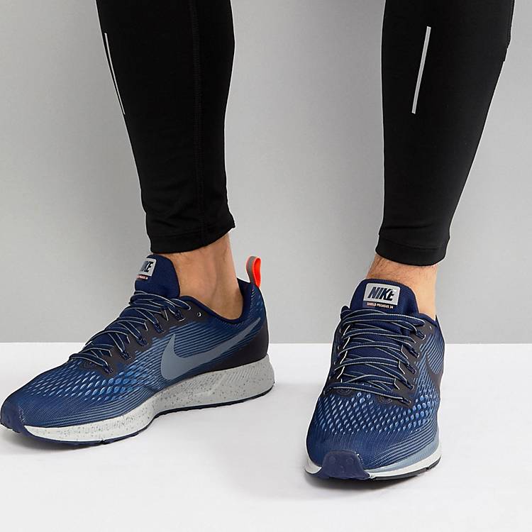 respirar habilitar estudiante universitario Zapatillas de deporte en azul 907327-400 Air Zoom Pegasus 34 Shield de Nike  Running | ASOS