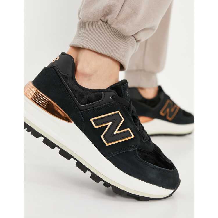 Zapatillas de deporte en colores negro y dorado rosa con cuna 574 de New Balance ASOS