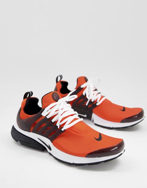 Zapatillas de deporte naranjas y negras Air Presto de Nike ASOS