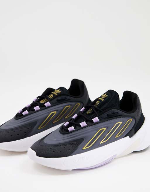 Zapatillas de deporte negras con detalles amarillos Ozelia de adidas Originals