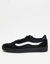 Vans negras best sale con raya blanca