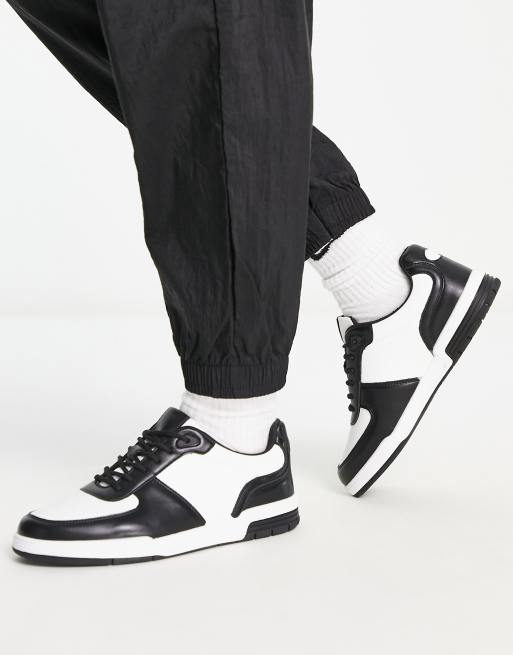 Zapatillas de deporte negras y blancas con suela gruesa de London Rebel