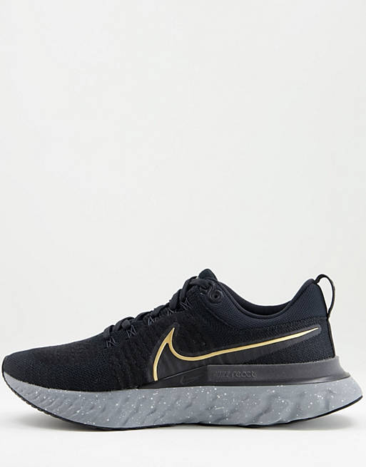 grieta receta Recientemente Zapatillas de deporte negras y doradas React Infinity Run Flyknit de Nike  Running | ASOS