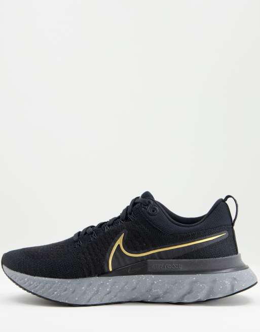 Inaccesible Organo Superioridad Zapatillas de deporte negras y doradas React Infinity Run Flyknit de Nike  Running | ASOS